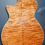 Taylor 612c guitar. Quilted maple back