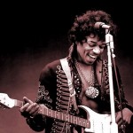 Jimi Hendrix playing guitar on stage