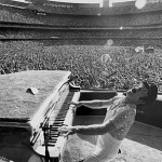 Elton John in concert. Stadium. early photo 70's