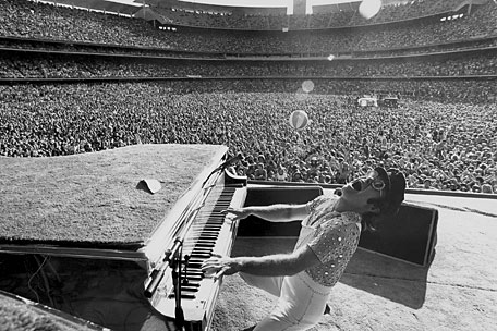 Elton John in concert. Stadium. early photo 70's