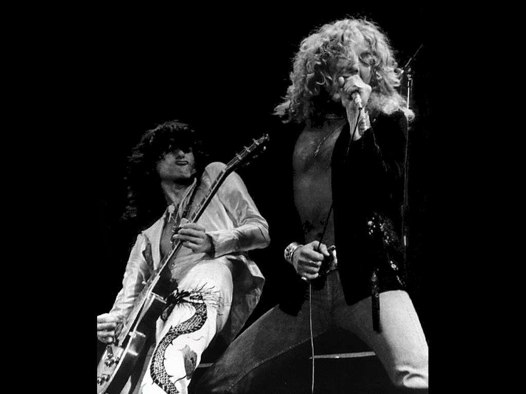 Led Zeppelin in concert. Robert Plant singing on stage with Jimmy Page