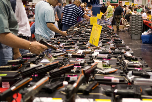 Gun show, rows and rows of guns.