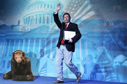Rand Paul at CPAC walking on stage with a monkey
