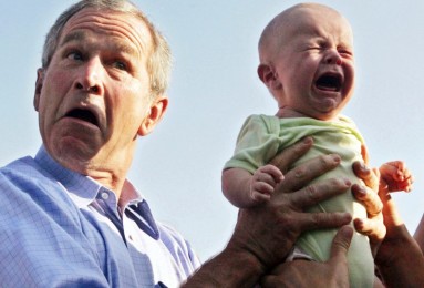 George W. Bush holding crying baby
