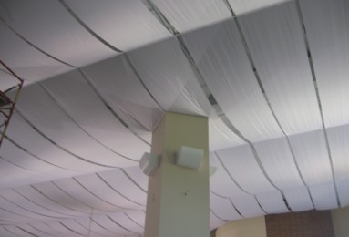Recording studio design: Fabric curls on ceiling.
