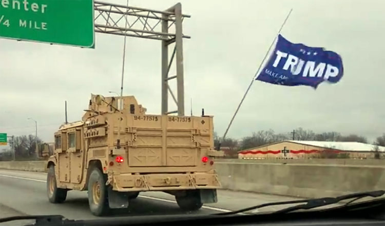 Trump flag on military vehicle, freeway