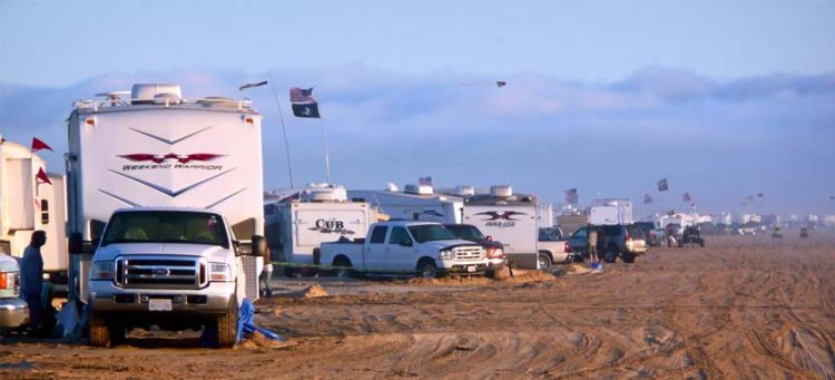 camping on the beach, cars, RVs