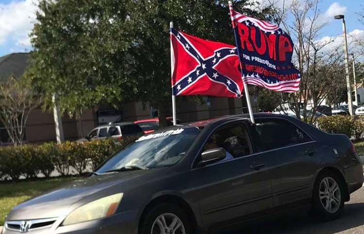 Trump flag, Confederate flag, small car