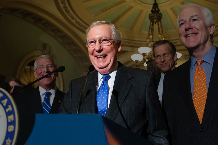 Mitch McConnell laughing, podium